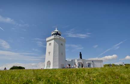 A white Victorian lighthouse