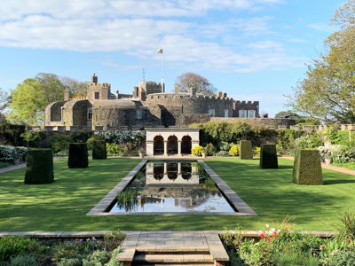 Walmer Castle viewed from the Queen Mother's Garden, with a lake, portico and topiary