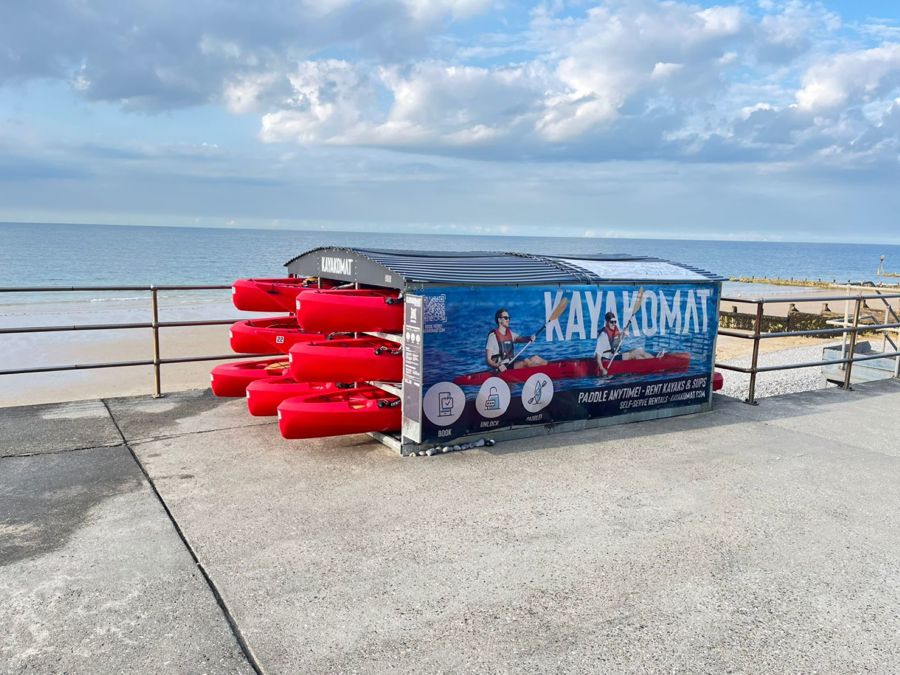 Kayakomat pod with red kayaks