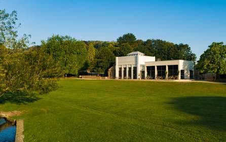 Exterior of Kearsney Café with picnic benches and lawn  