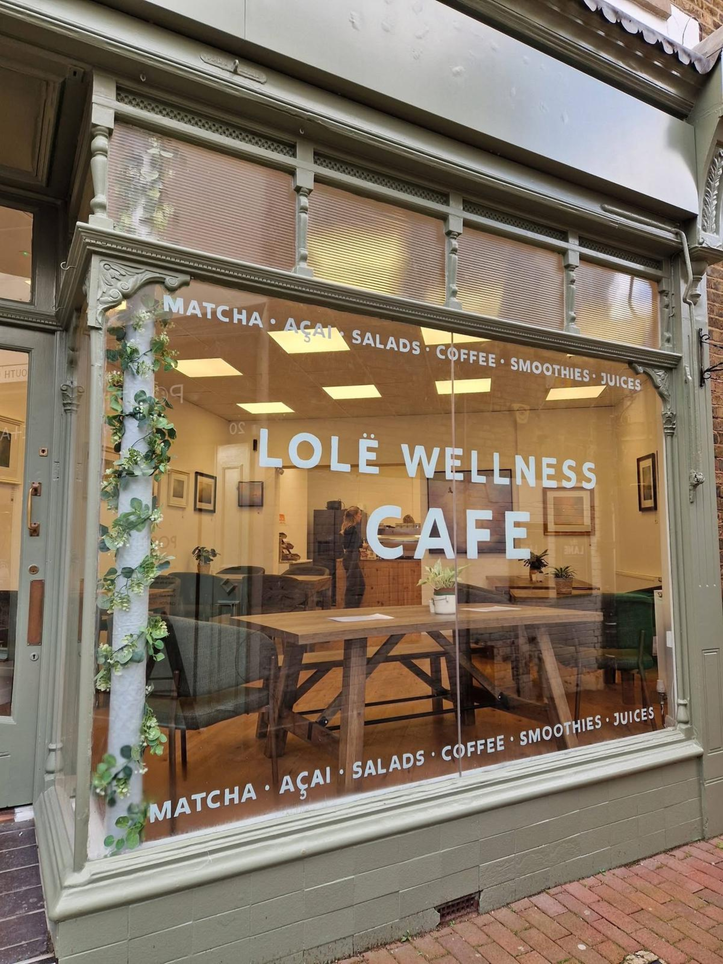 Lole Wellness Café window showing table & chairs in the interior