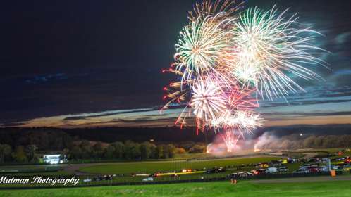 Lydden race track at night with fireworks lighting up the sky.