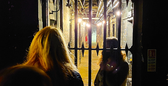 People waiting in front of the gate to the Dover Gaol