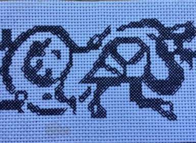 Cross stitch featuring the Maison Dieu logo