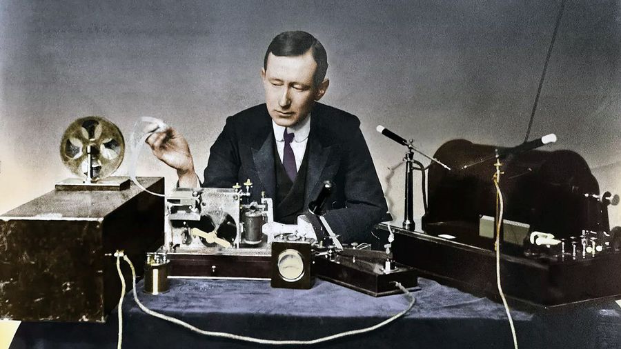 A man - Marconi - with various radio equipment