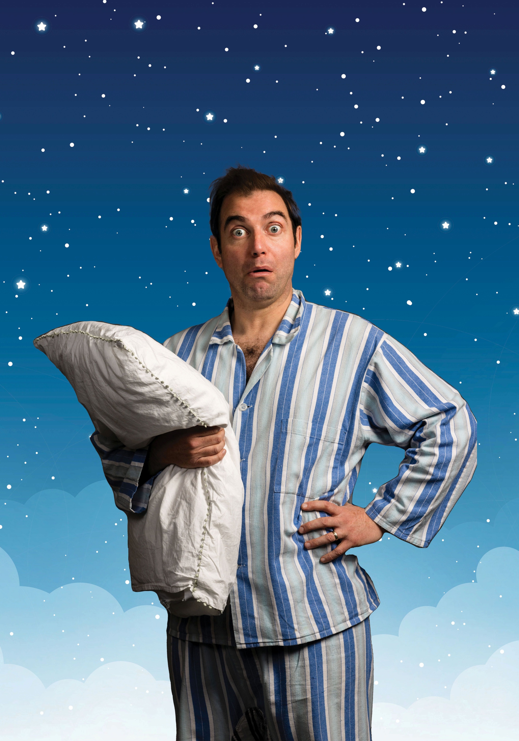 Mr Sleepybum in his striped pyjamas holding a pillow