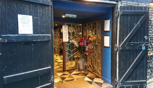Inviting blue door entrance to Namaste Restaurant