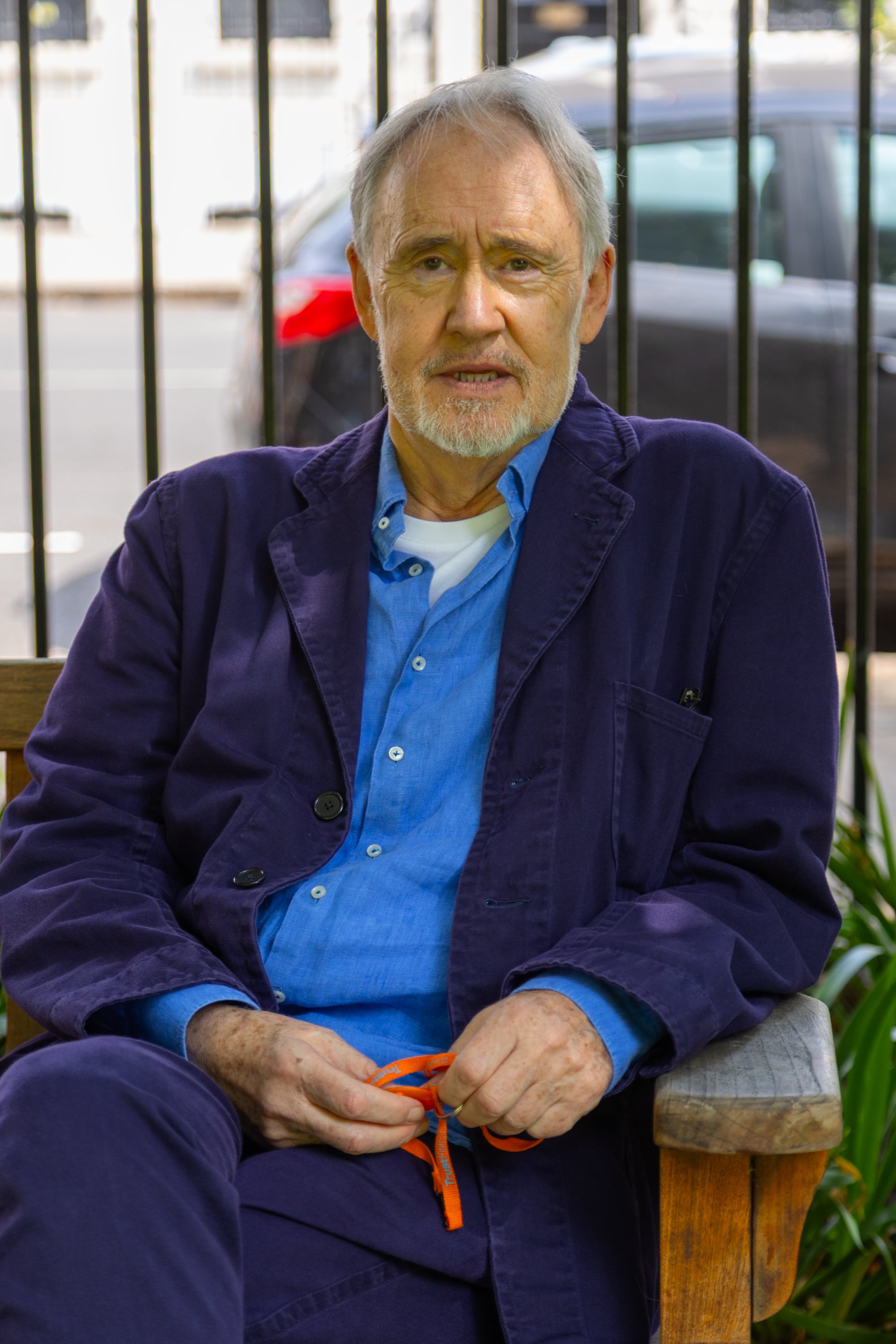 Nigel sitting on a park bench