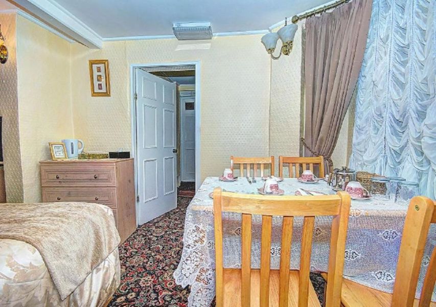 Bedroom with dining table and chairs