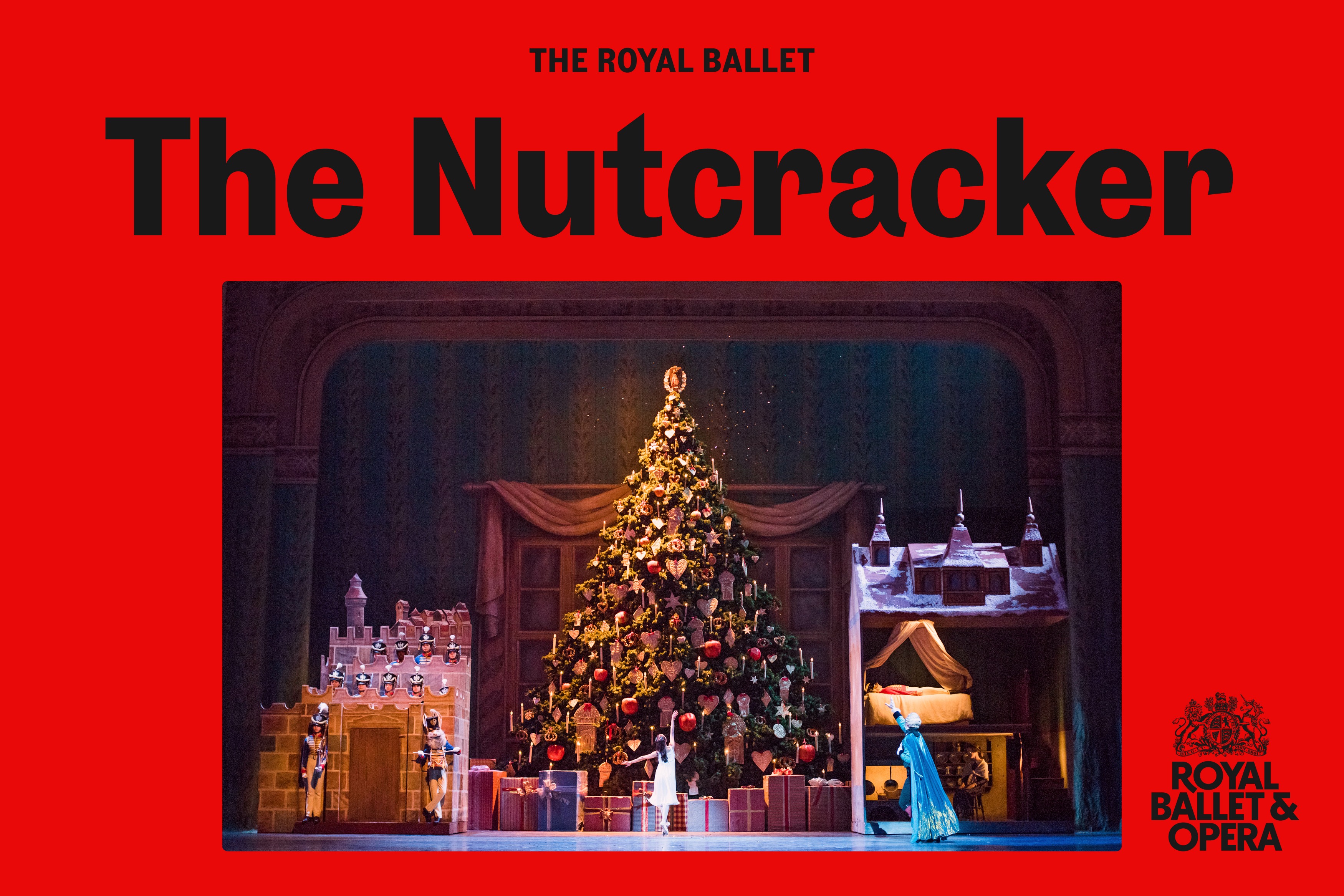 A stage set with Christmas Tree, presents and toys and ballet dancers