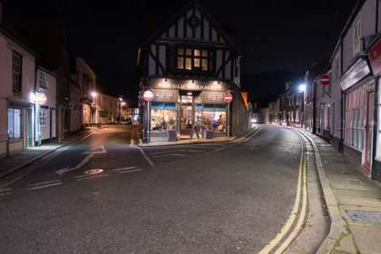 Night time exterior of The Old Pharmacy Bar