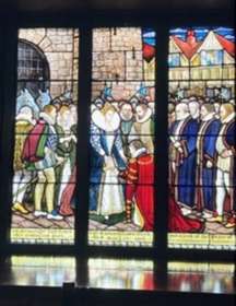 Stained glass window showing Queen Elizabeth's tour of Sandwich