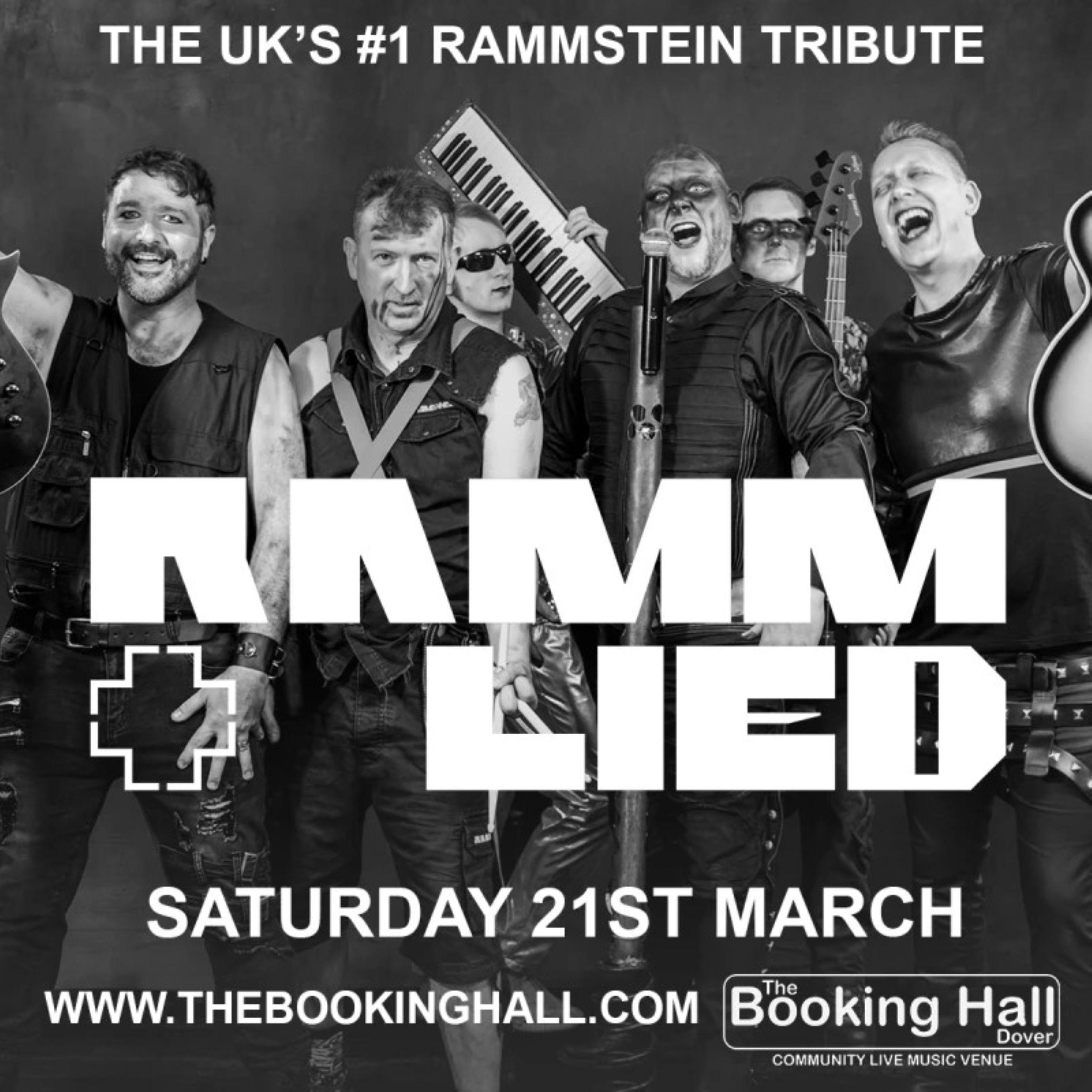 6 male musicians with a keyboard & guitar and some have paint on their faces.