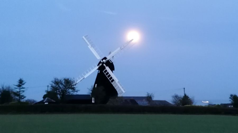 Ripple windmill with the sun setting behind the sails