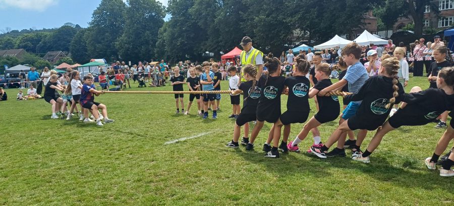 Children involved in a game of tug a war
