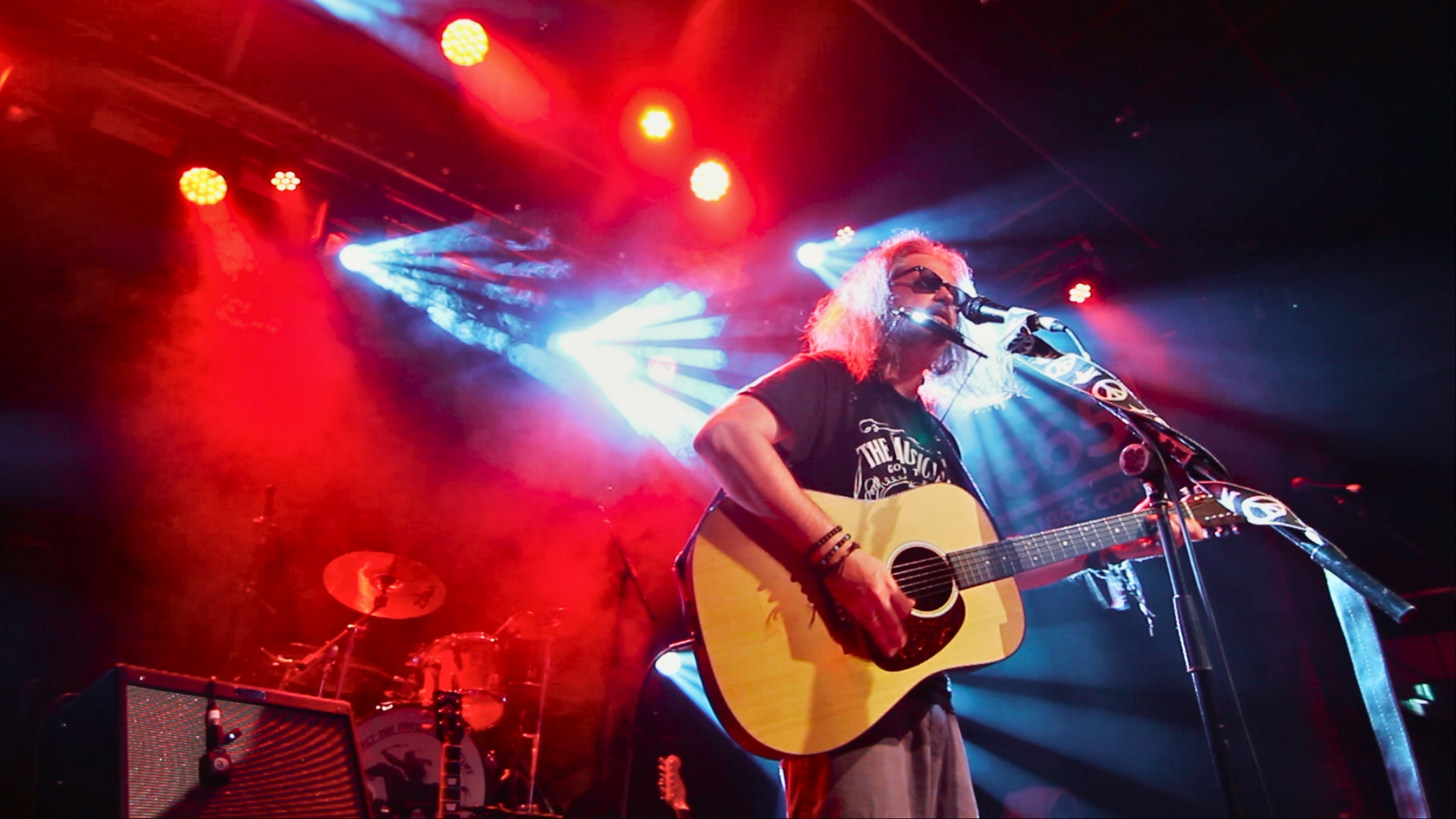 Rust for Glory on stage under spotlights