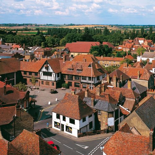 Red tiled rooftops of Sandwich and the black-and-white Guildhall in the centre of the picture