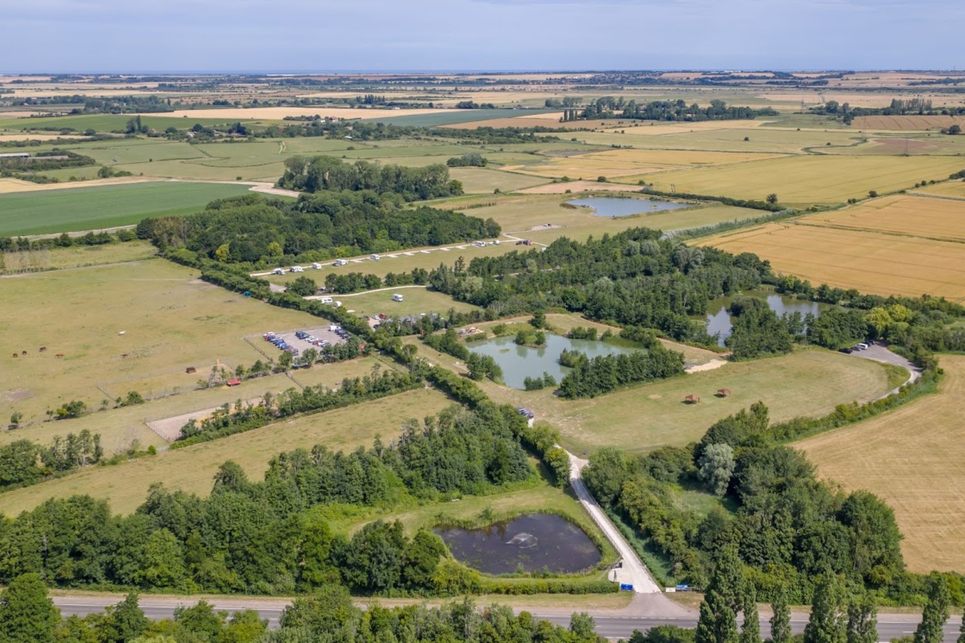 Ariel view of green countryside with lakes