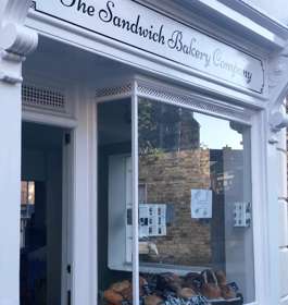 The shop window of The Sandwich Bakery Company displaying a selection of artisan breads