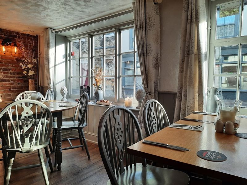 Tables and chairs by the sunny window