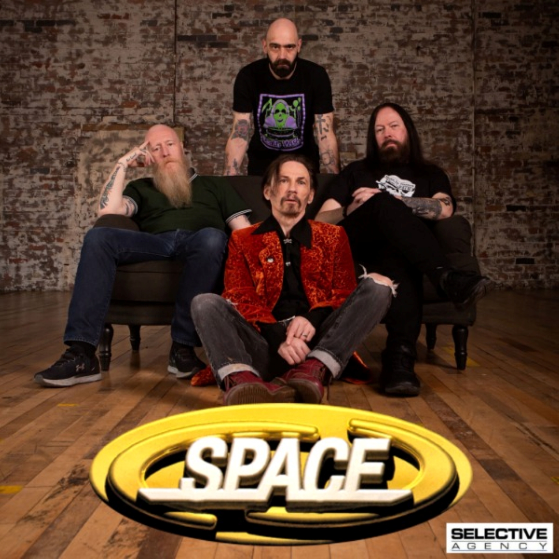 4 band members sitting and standing