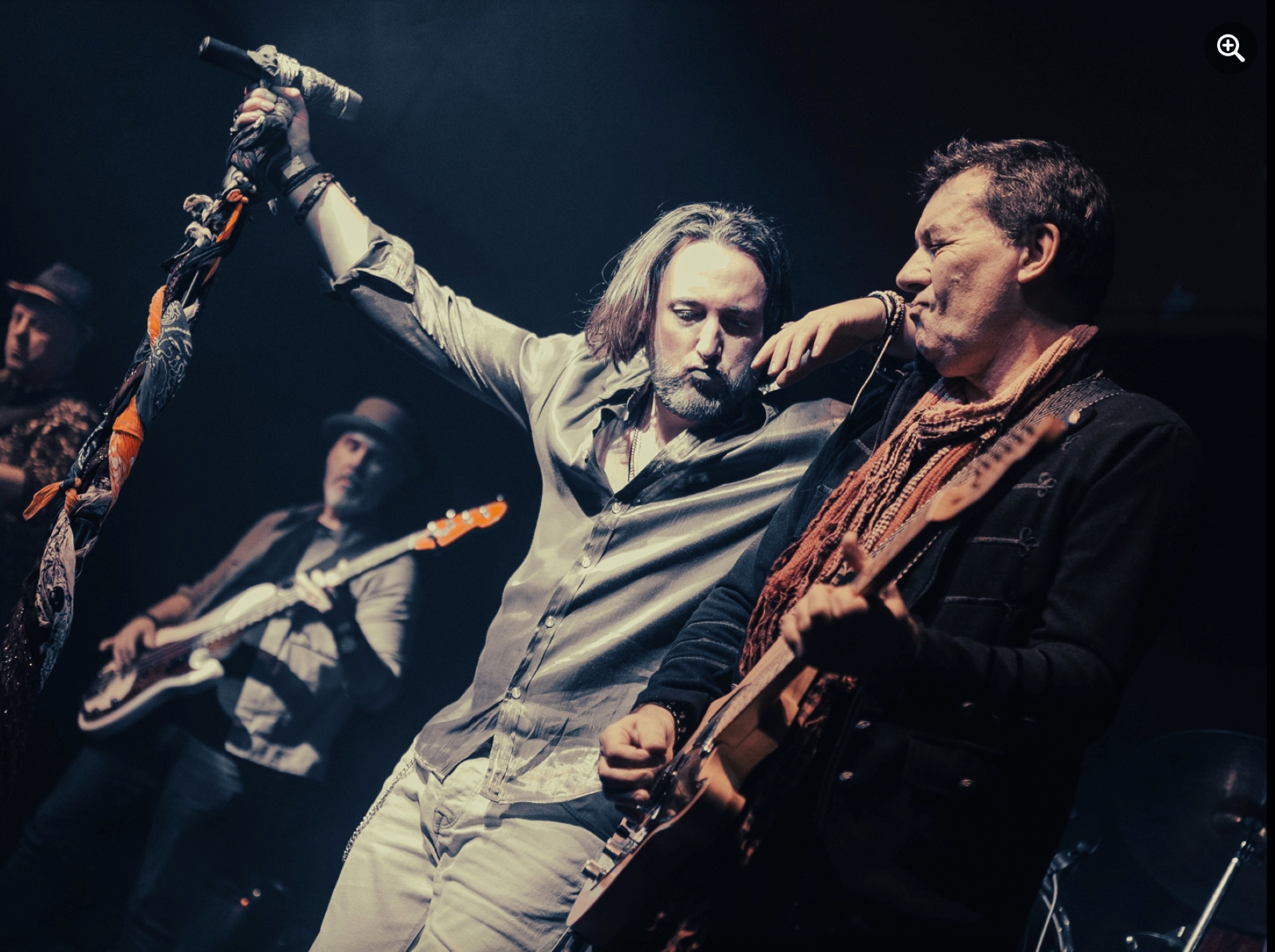Members of the band Stoned performing on stage