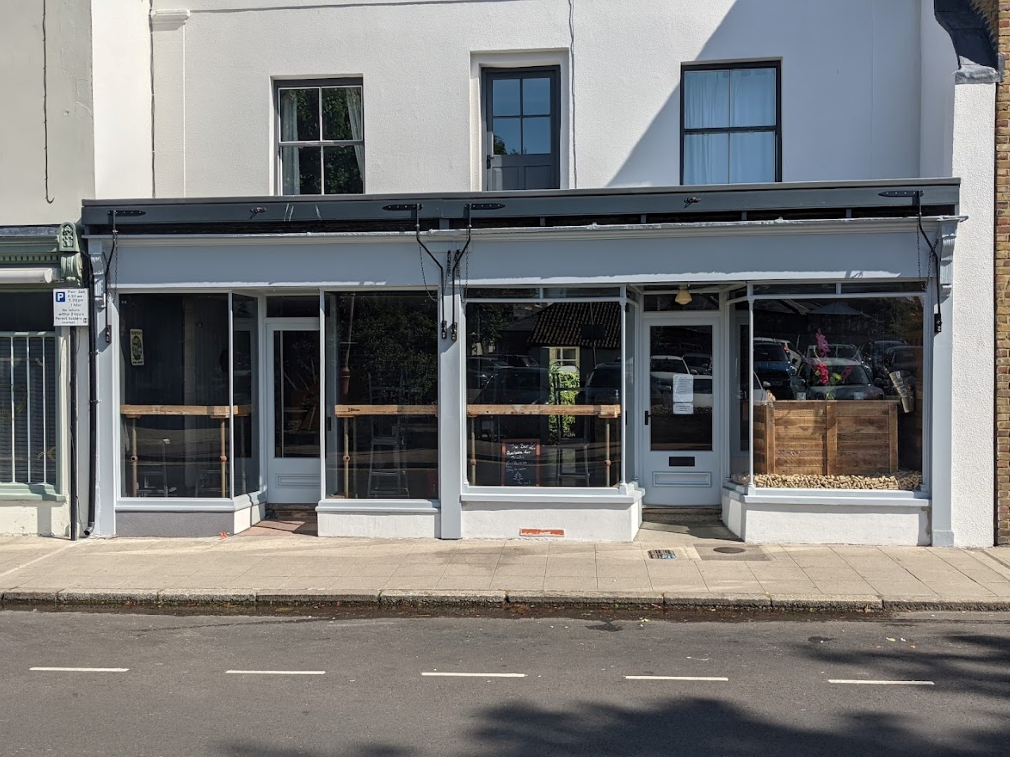 Front of The Bar with large double windows.