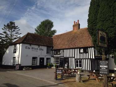 The front entrance to the Black Pig with half black and white timbered building