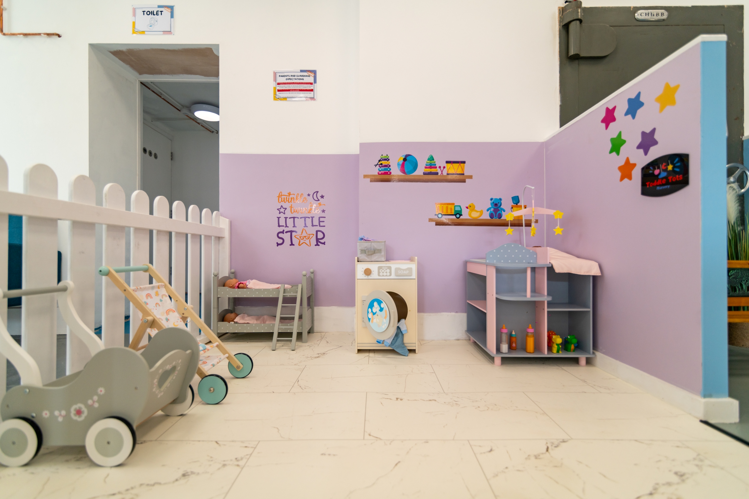 Play room for young children with toy washing machine. pushchairs & bunk bed with dolls.