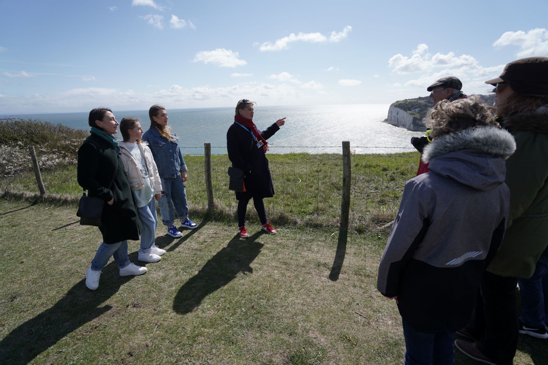 A group of people on a clifftop
