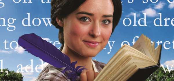 Image of an actress portraying Jo March with a book and purple quill pen