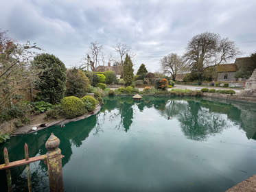 A pond with a stone edging
