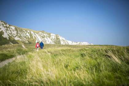 Couple walking along pathway at Samphire Hoe