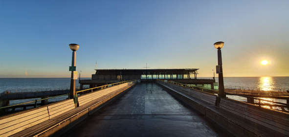 Deal Pier at sunset, looking down the pier towards the sea